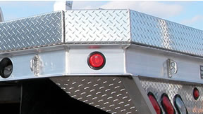 This picture shows a side view of a Highway Products aluminum truck flatbed with our popular six inch side-boards. See more at highwayproducts.com